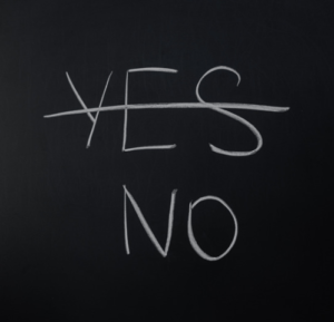 picture of a chalk board with the words yes and no written on them. Yes is crossed out.